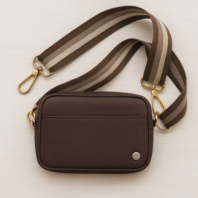Brown purse with brown and white striped strap